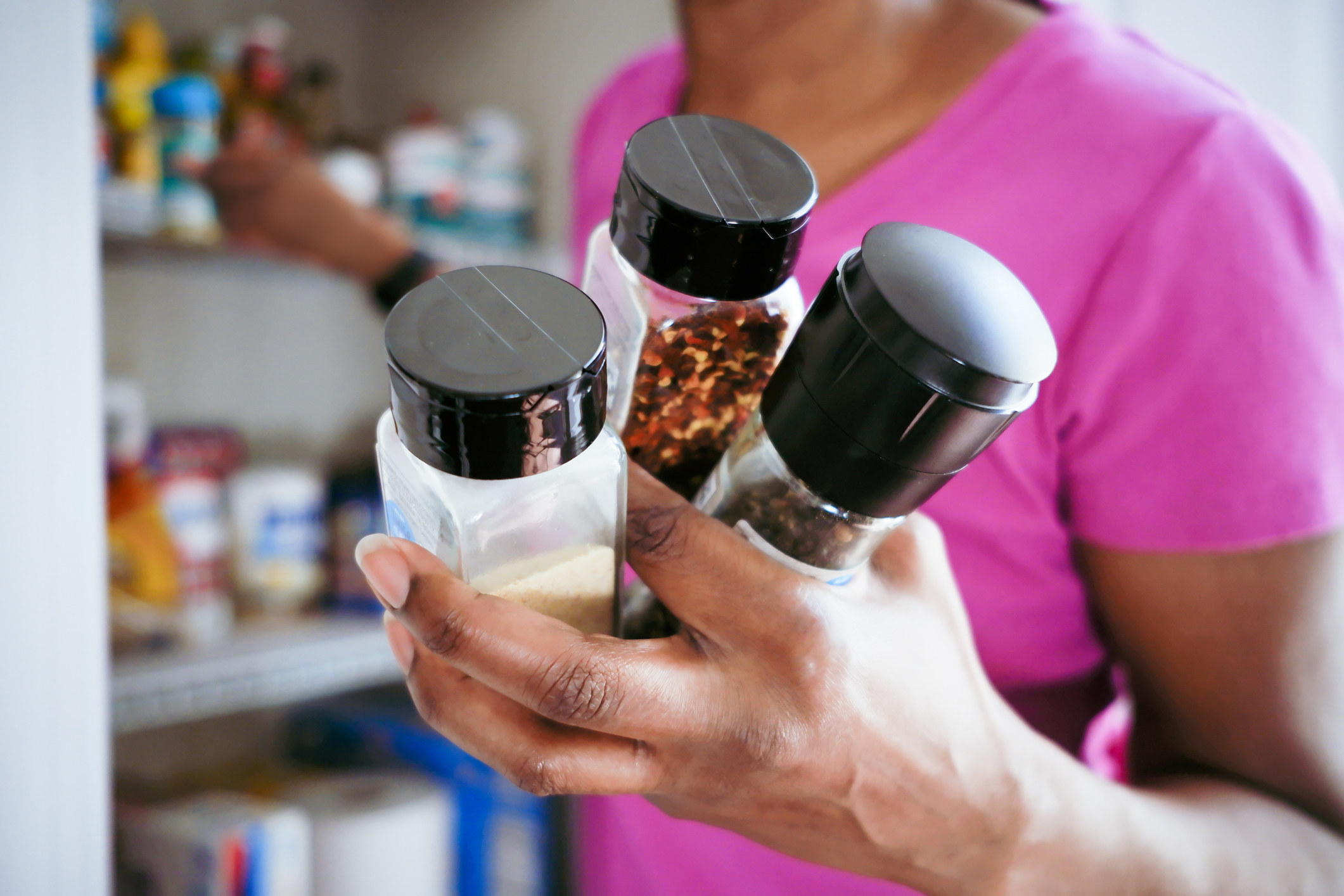 grabbing spices from the pantry