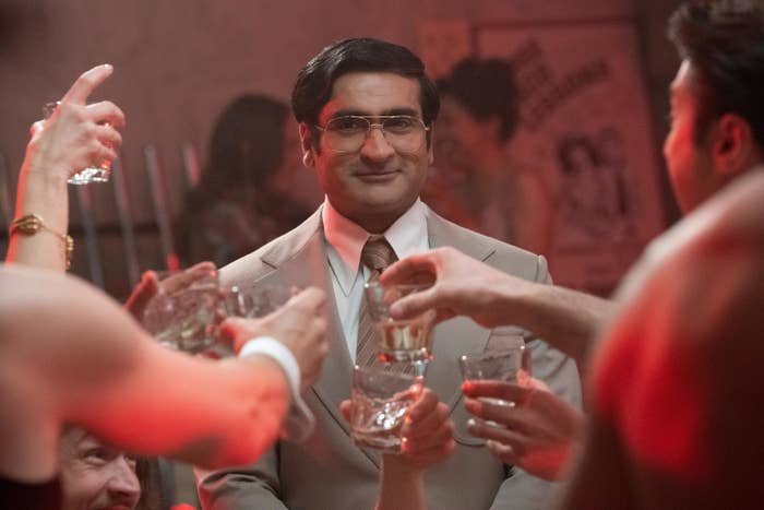 Kumail in a scene from the film watching others make a toast
