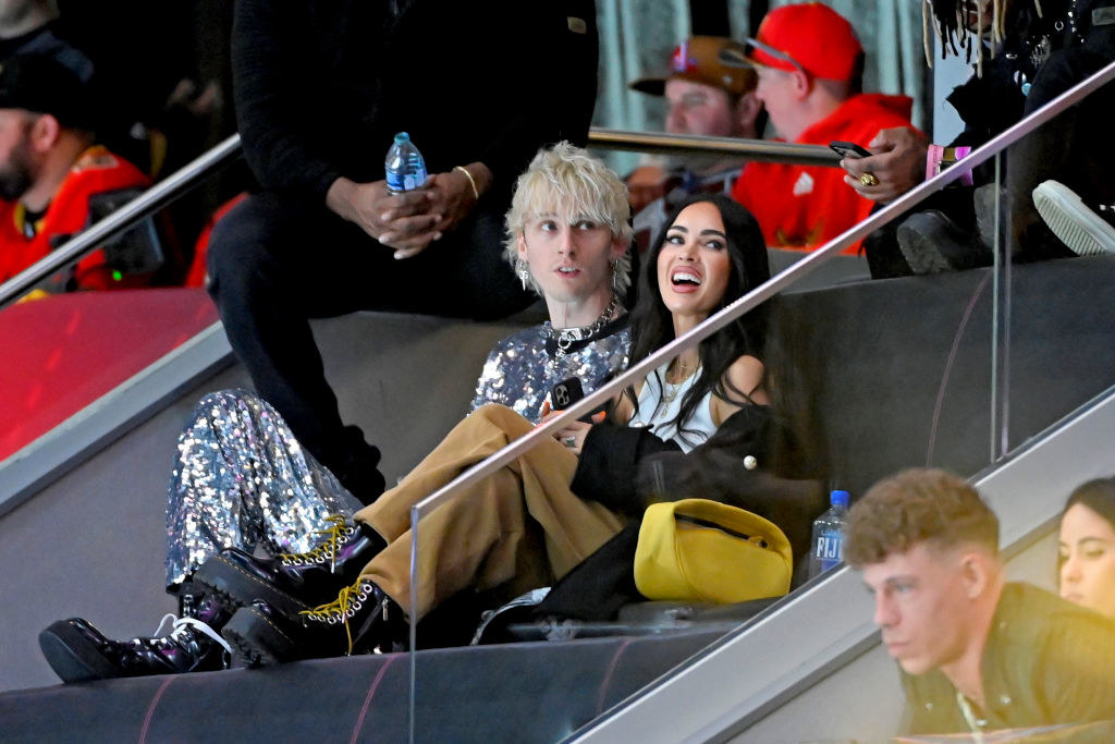 Machine Gun Kelly and Megan Fox are seen in the stands after his performance during the 2022 Honda NHL All-Star Game