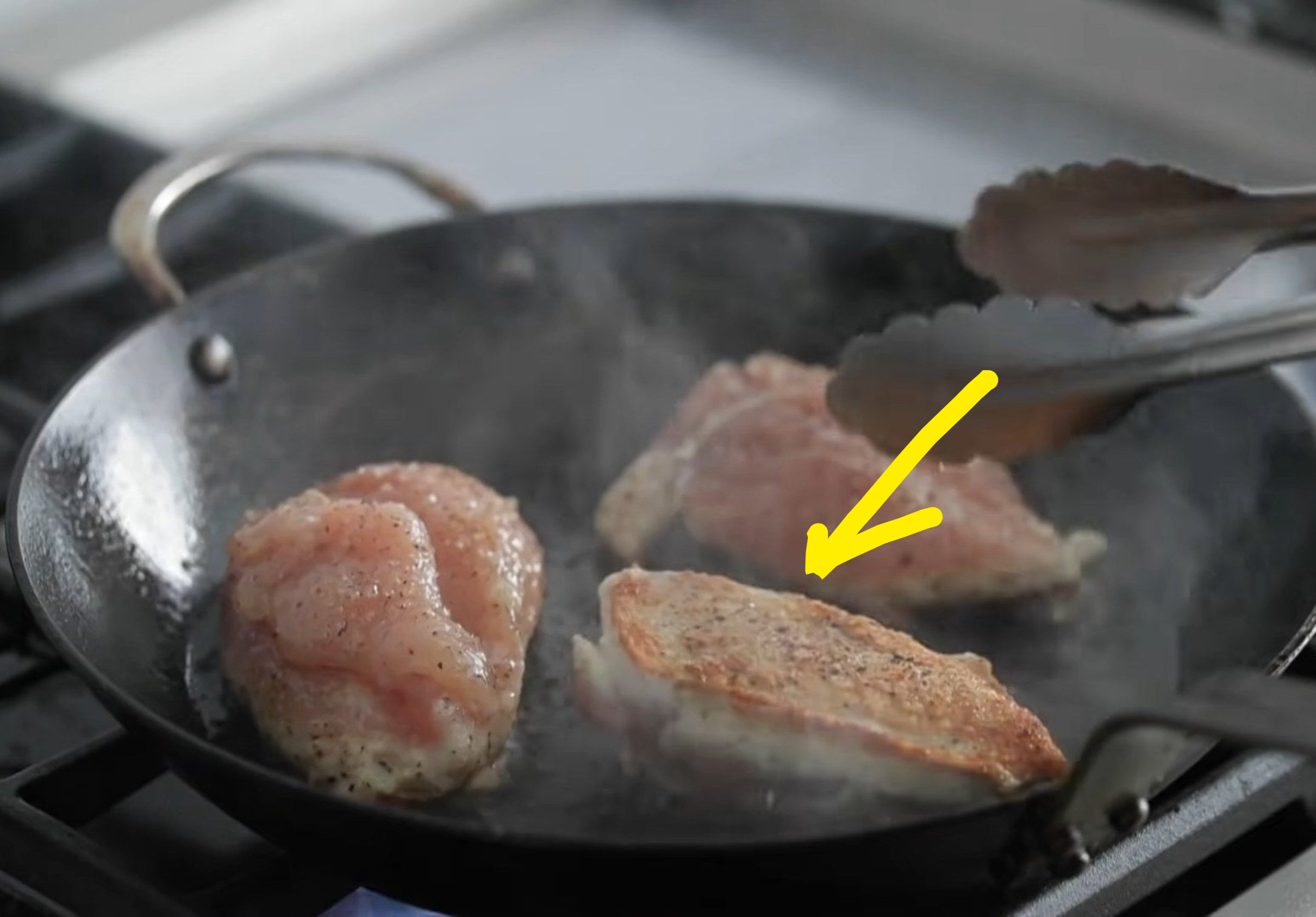 browning chicken in a pan