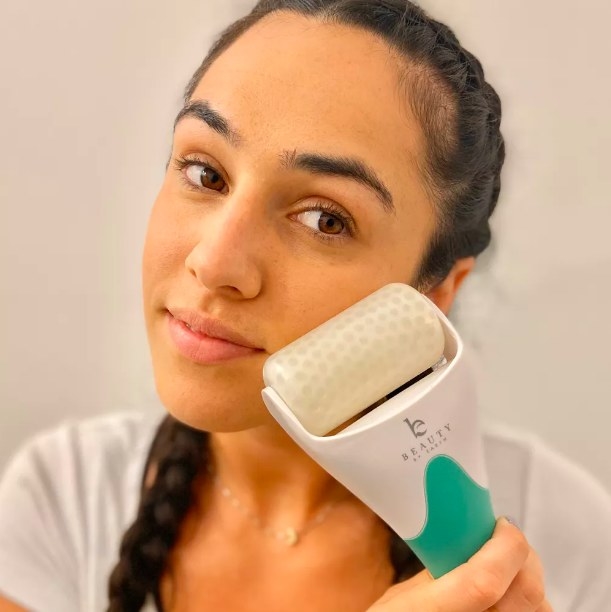 Person using face roller