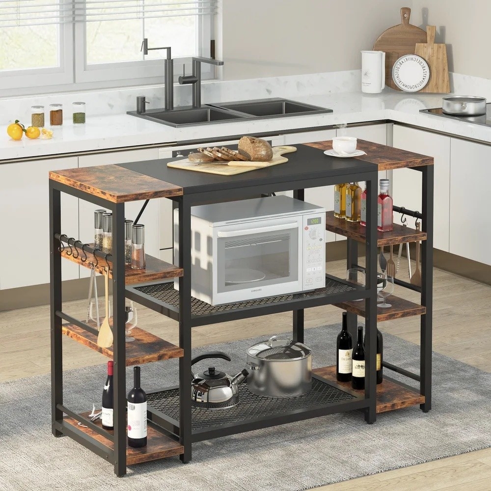 A kitchen island with shelving underneath. It is industrial style with wood and metal