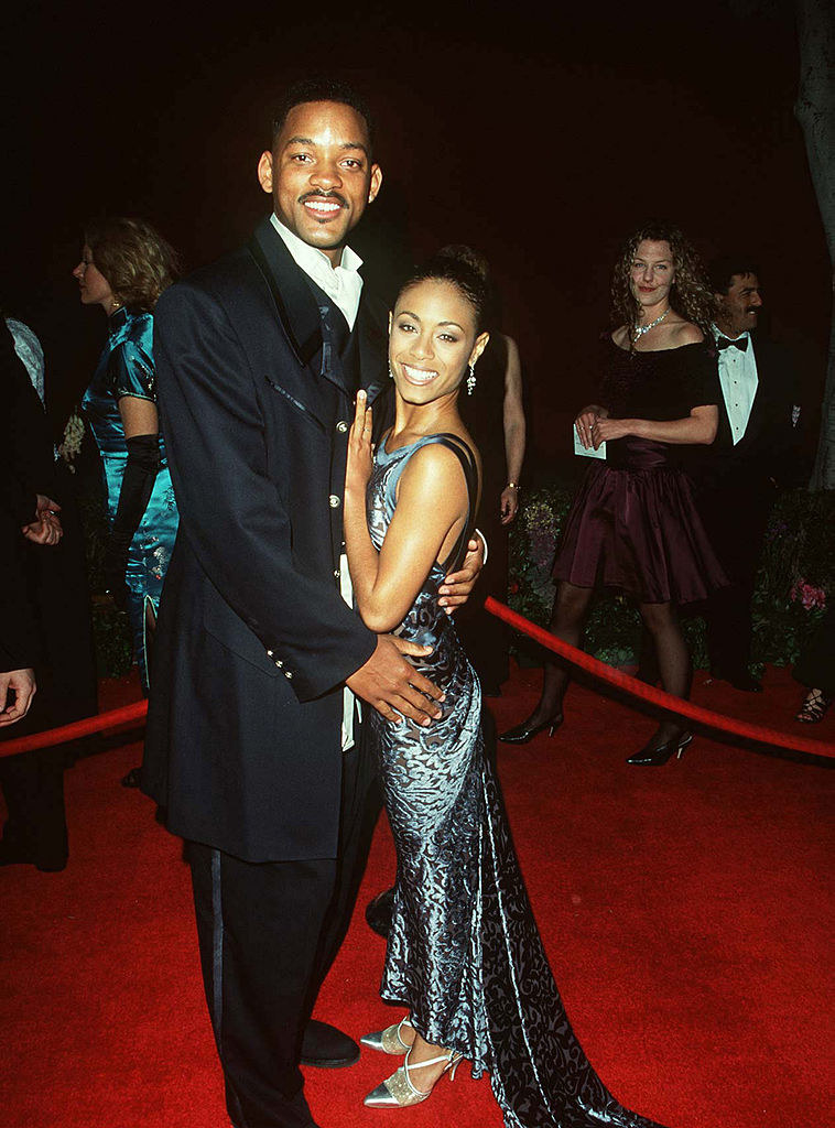 Will Smith and Jada Pinkett Smith embracing on the red carpet