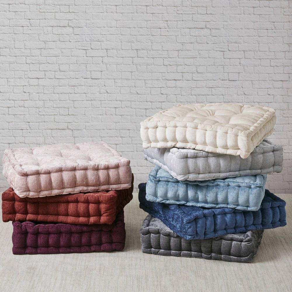 tufted square pillows in warm and cool colors