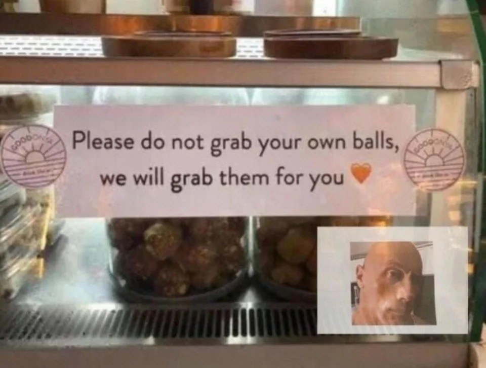 a sign that says, &quot;Please do not grab your own balls, we will grab them for you&quot;