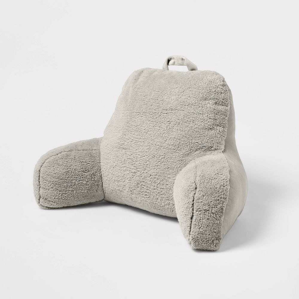 grey fuzzy armrest pillow