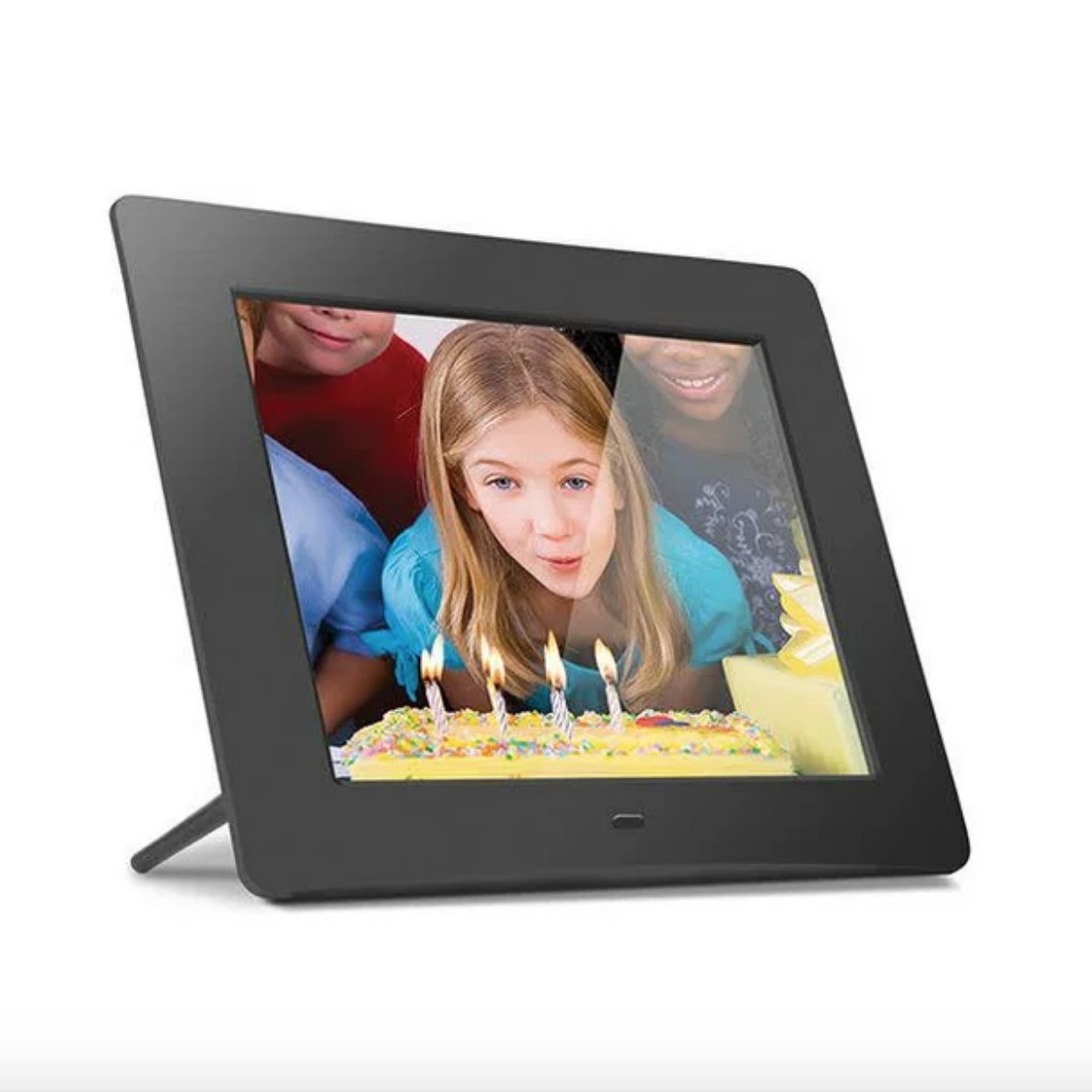 Black digital frame with photo of child blowing out candles on a birthday cake