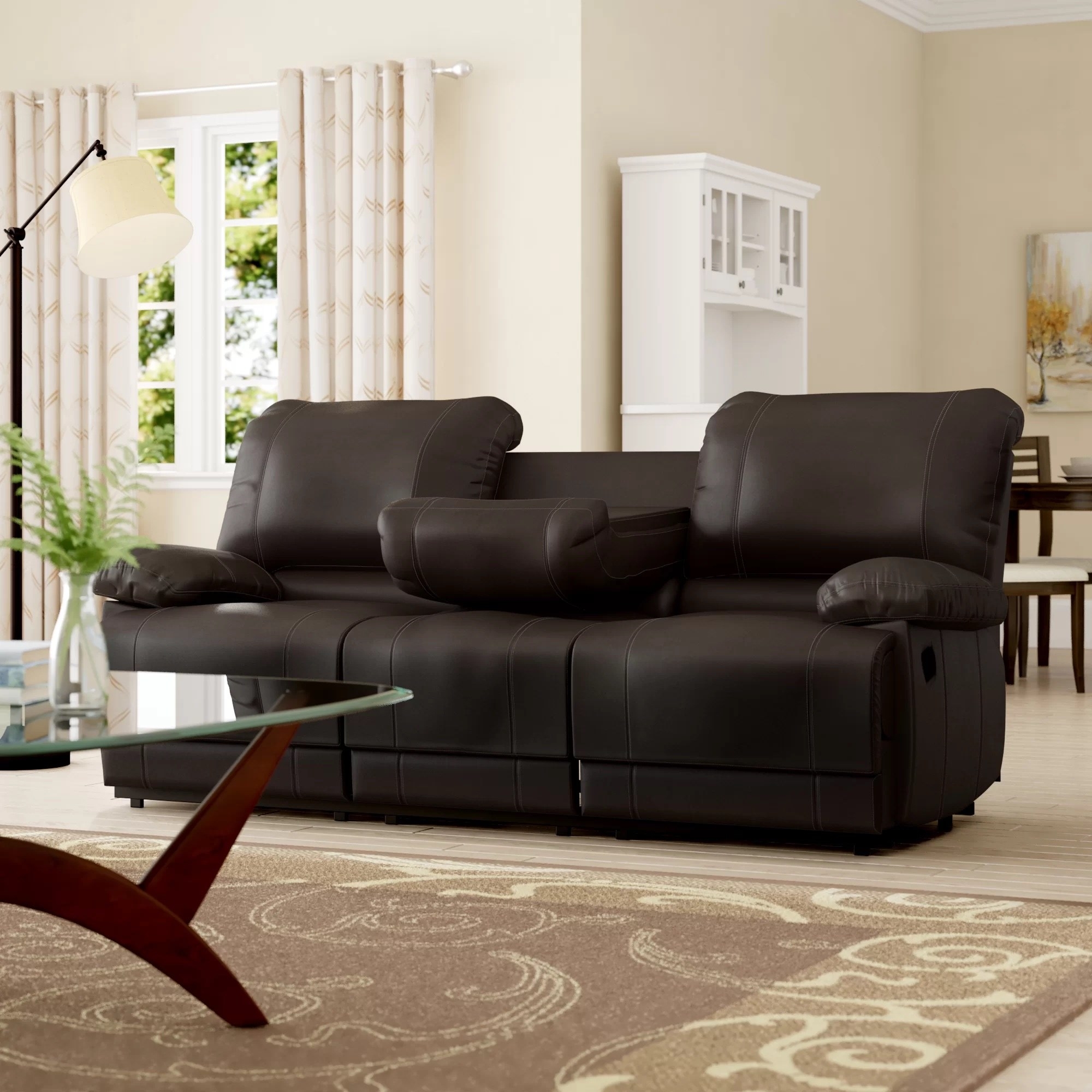 a black leather sofa in a living room