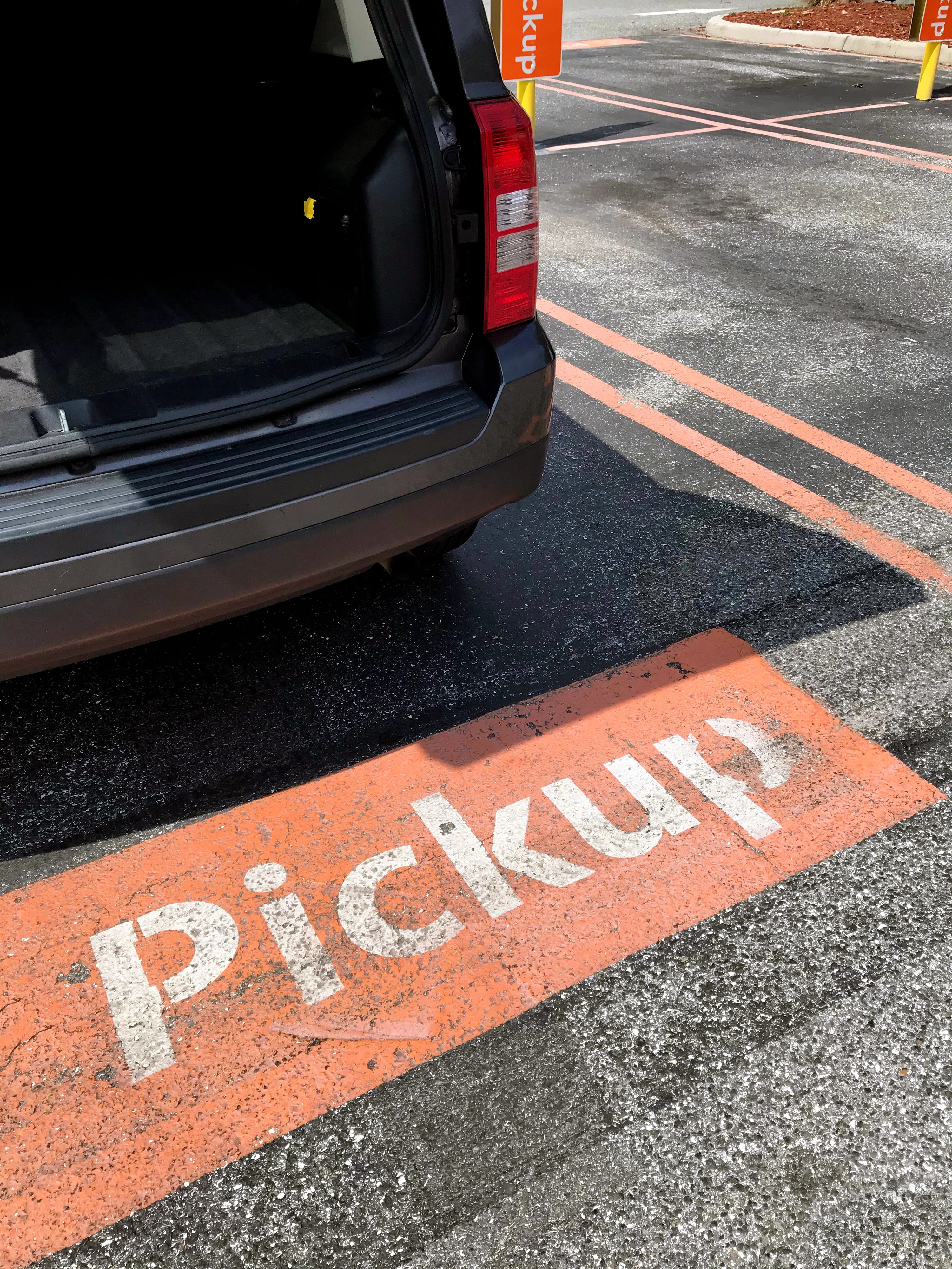 pickup sign in a parking space at a store