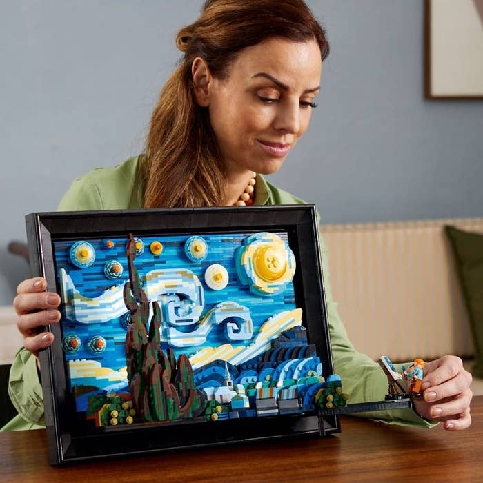 Person with Lego Starry Night set