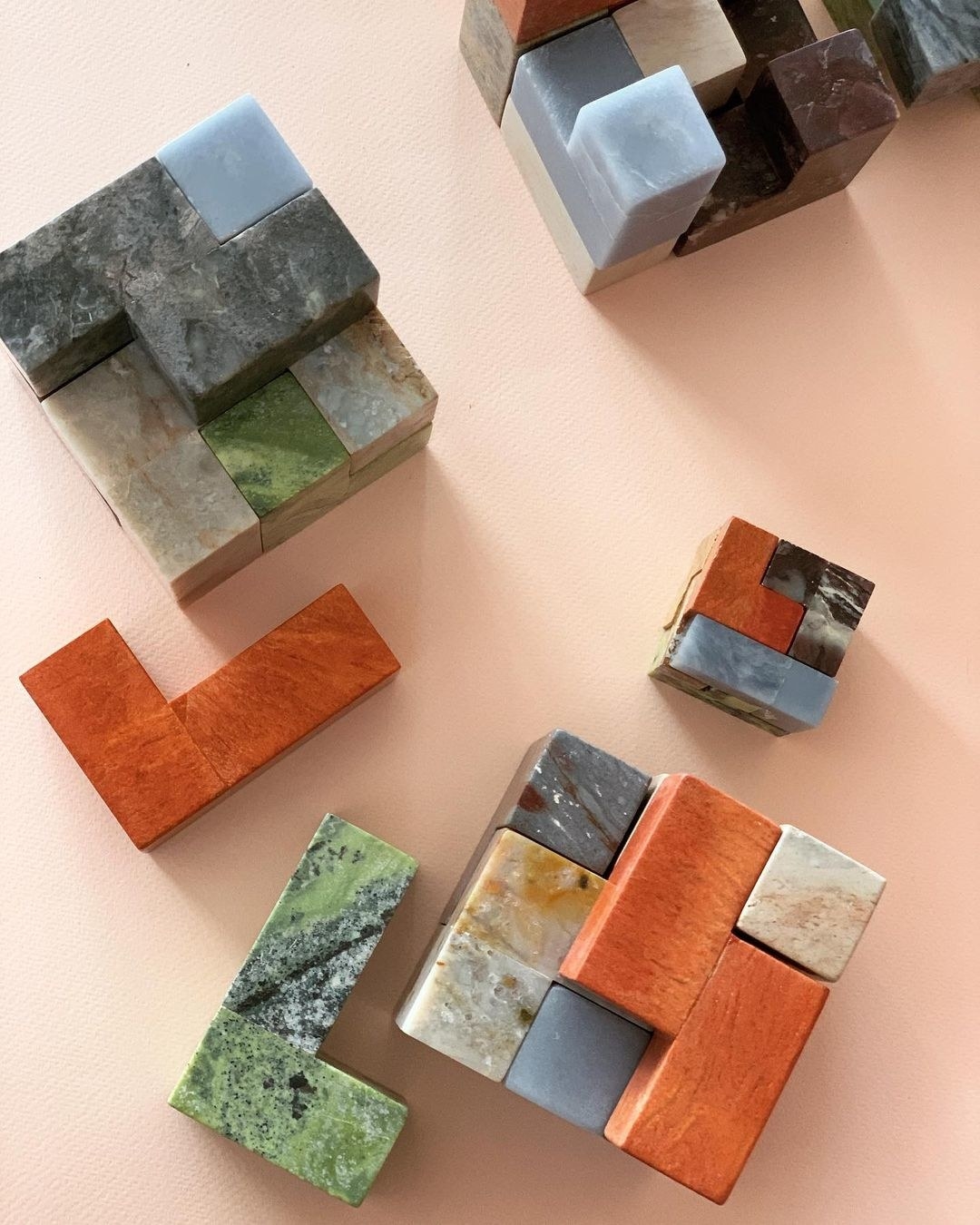 a puzzle cube with each piece made of a different stone