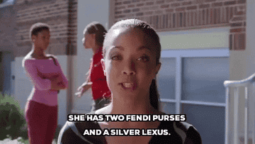 A woman saying, &quot;She has two Fendi purses and a silver Lexus&quot;