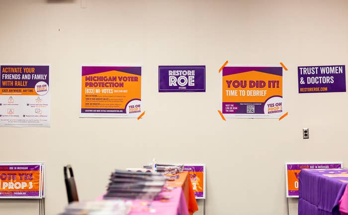 Yes on 3 and Restore Roe signs hang in a campaign office