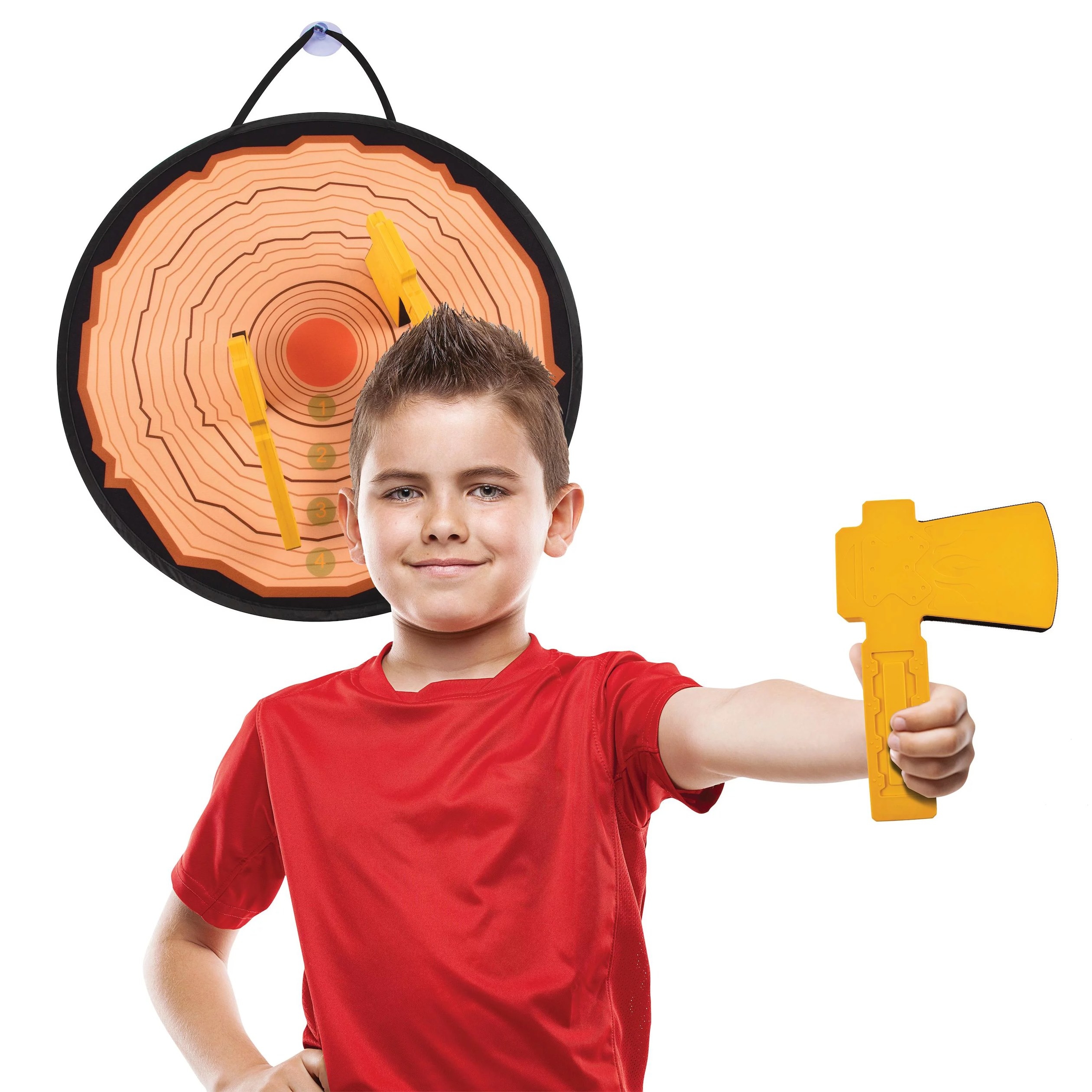 Boy holding axe in front of target