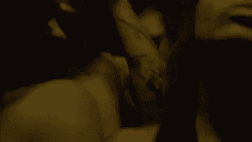 People dancing and a man ruffles his hair and throws his head back