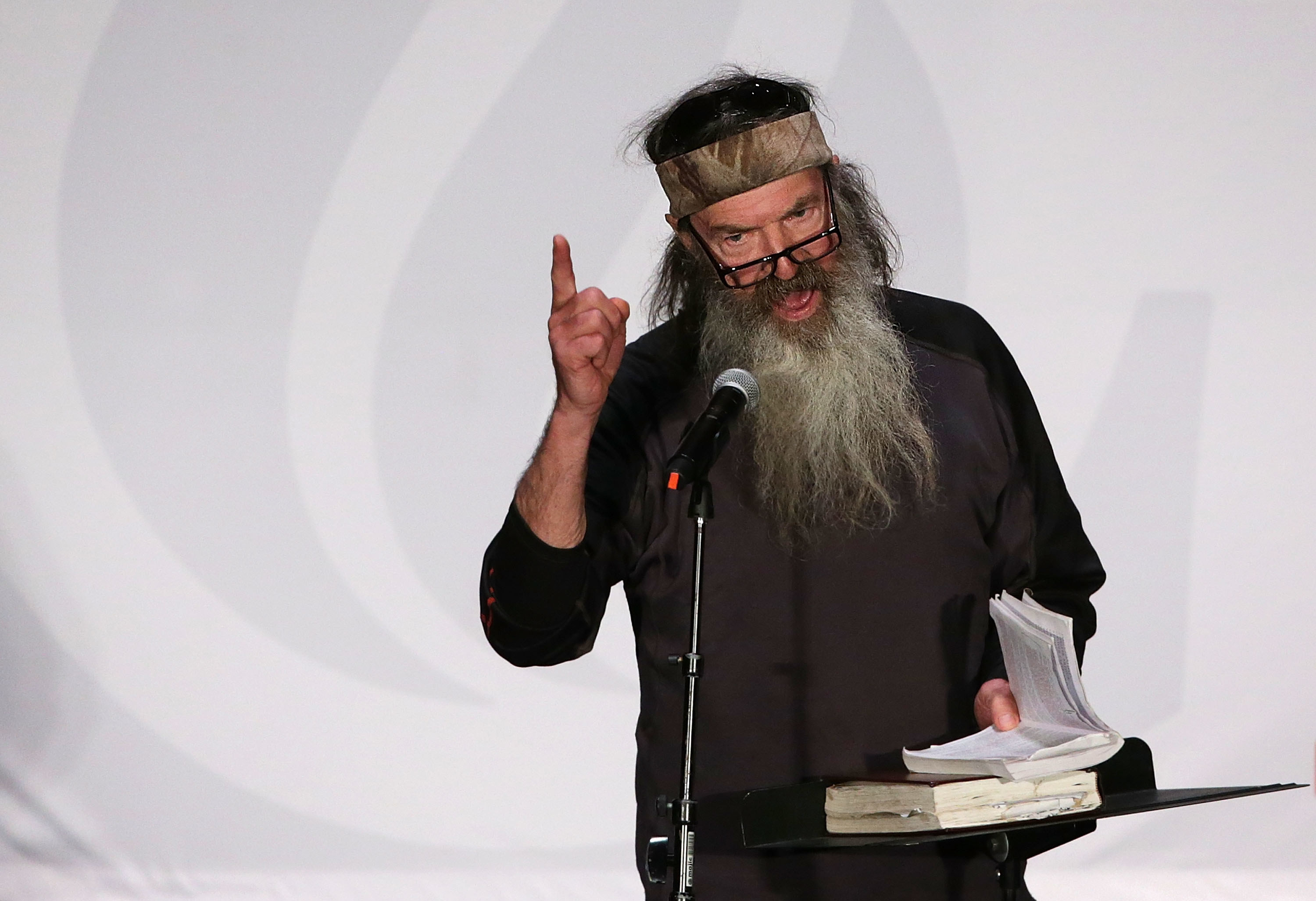 Phil Robertson speaking to a crowd onstage