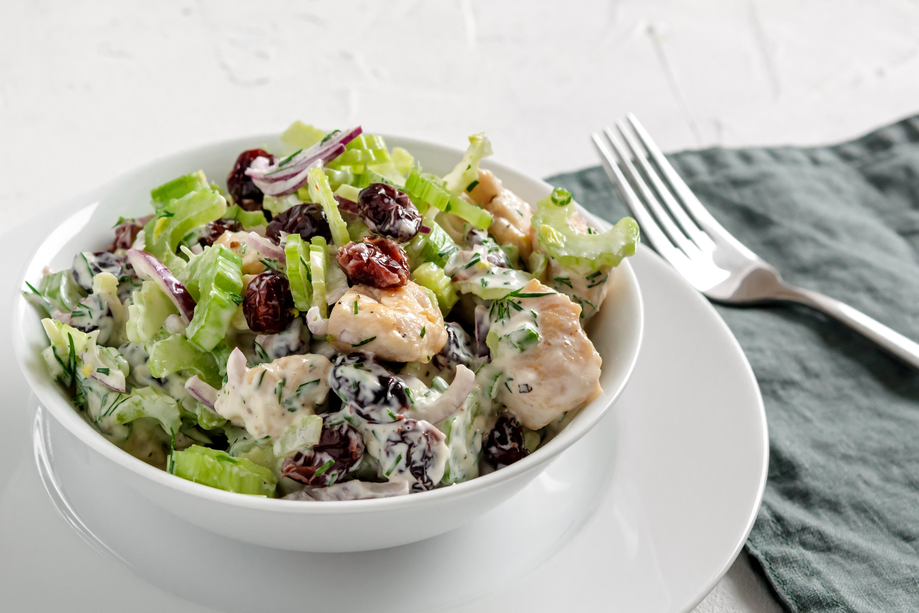 Salad with celery, chicken, cranberry, red onion, dill and yogurt
