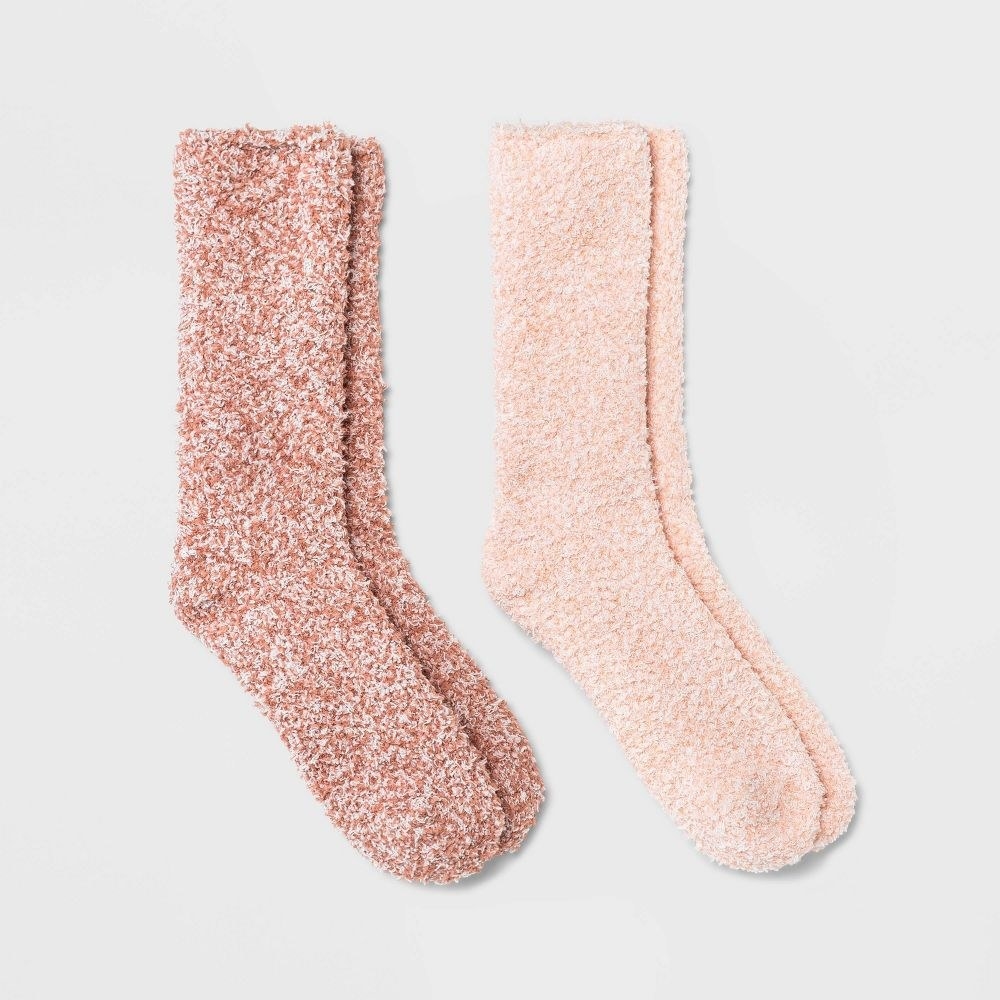 a pair of light pink and a pair of dark pink marked fuzzy socks