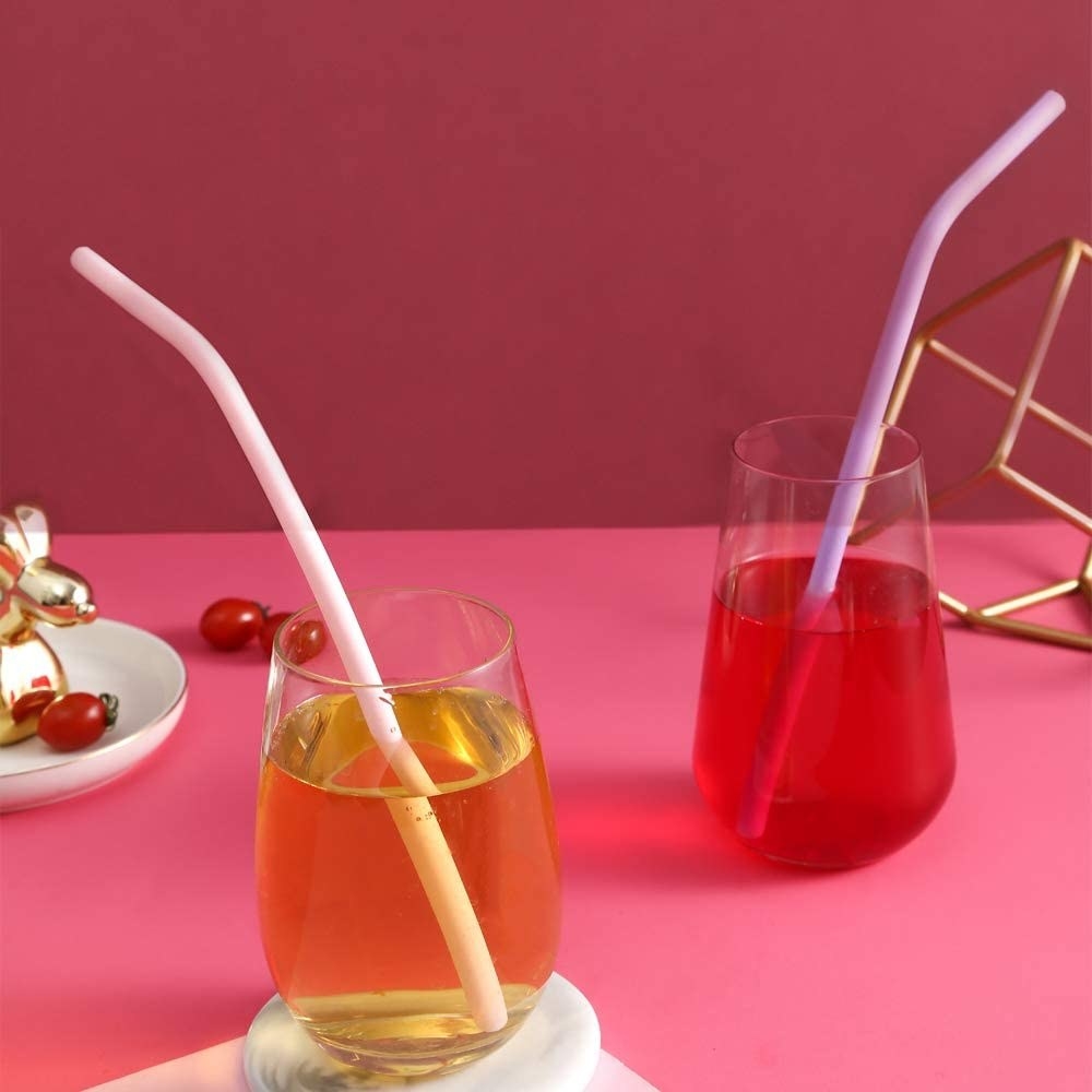 two straws in vibrant beverages