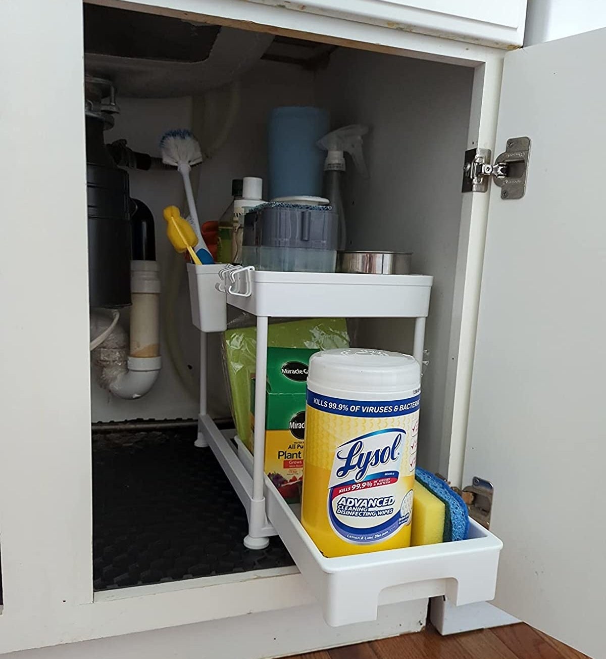 Reviewer image of organizer filled with cleaning supplies
