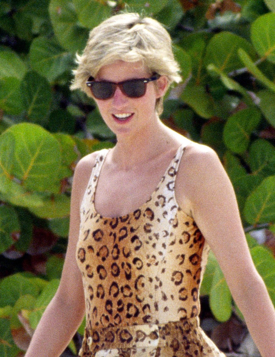 Princess Diana wearing a leopard-print bathing suit and sunglasses