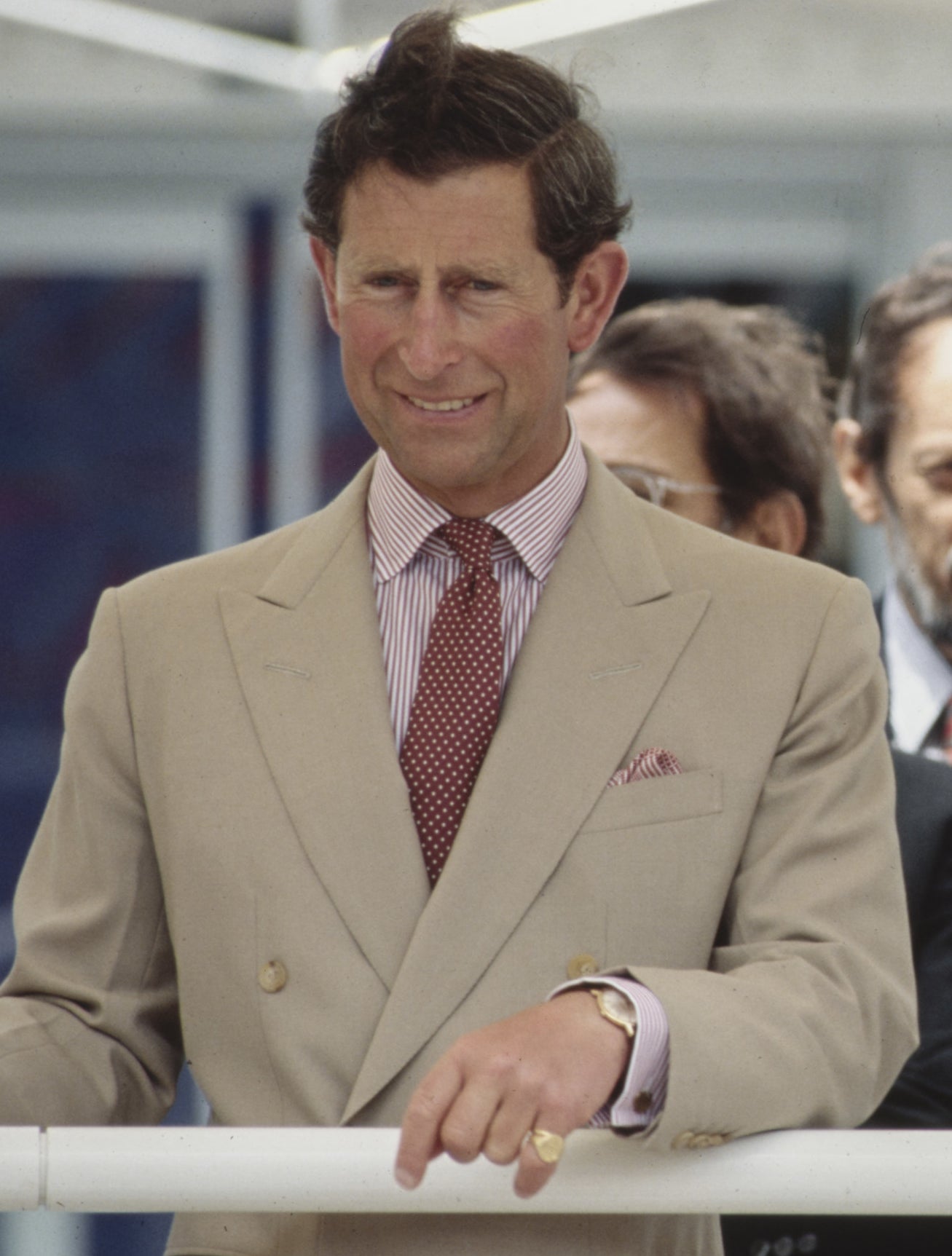 Prince Charles in a tan suit and polka dot tie