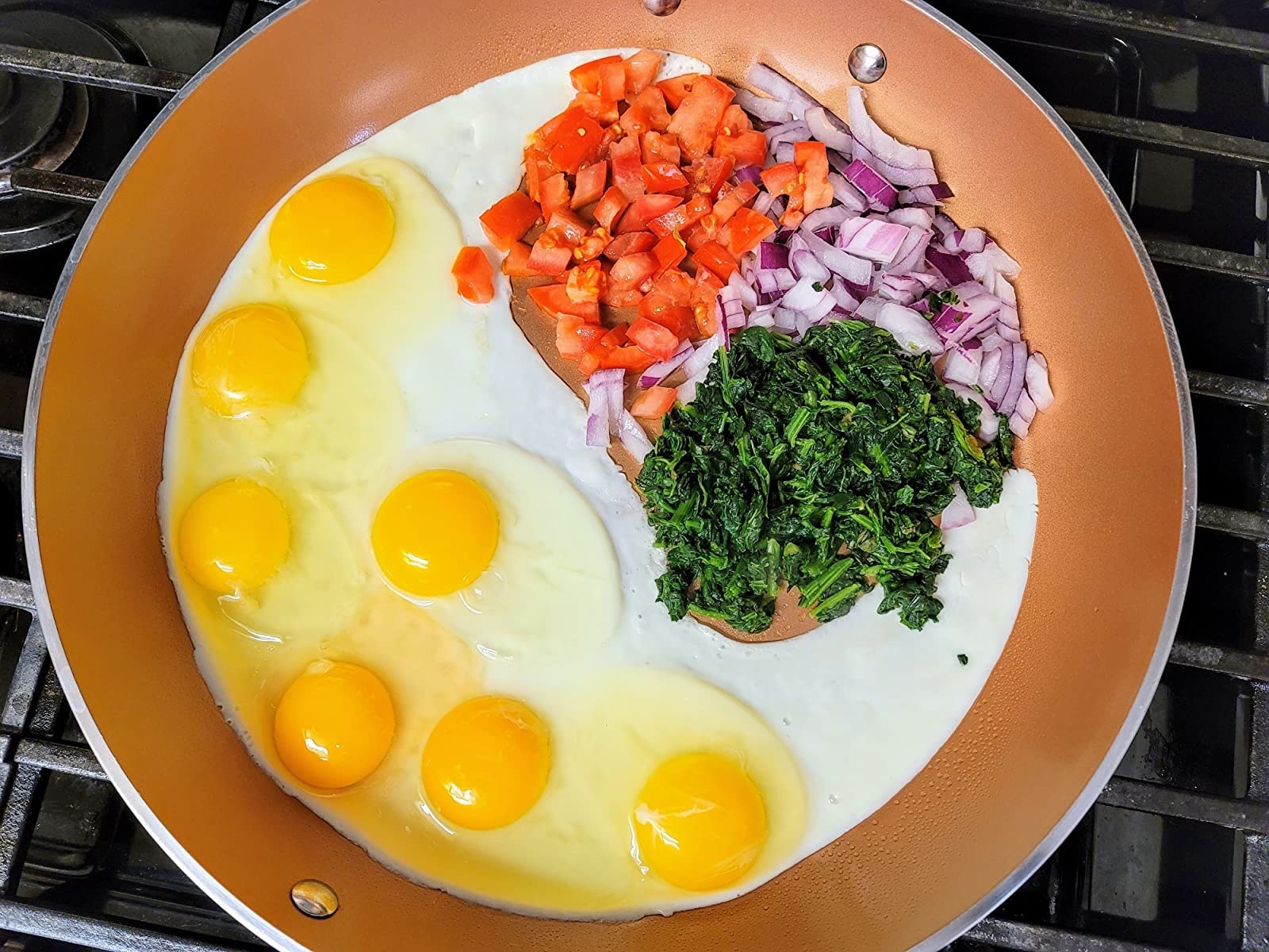 Reviewer image of eggs and other ingredients in the pan