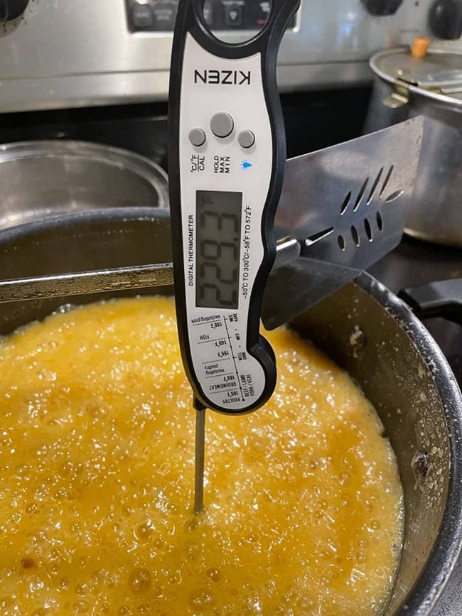 Reviewer's thermometer being used with hot liquid in a cooking pot