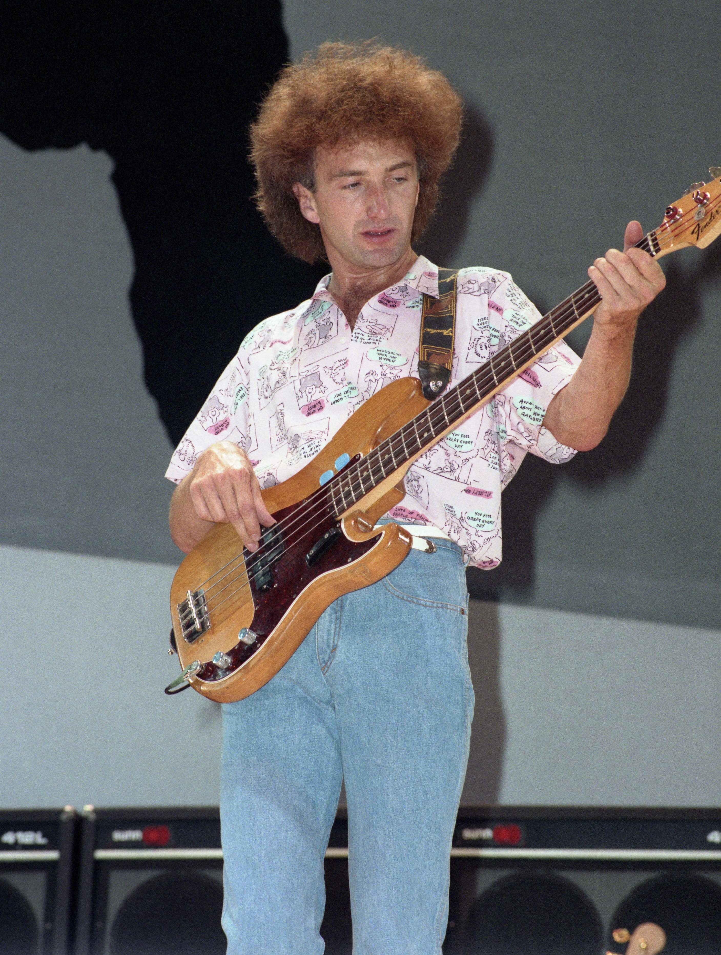 John playing bass on stage