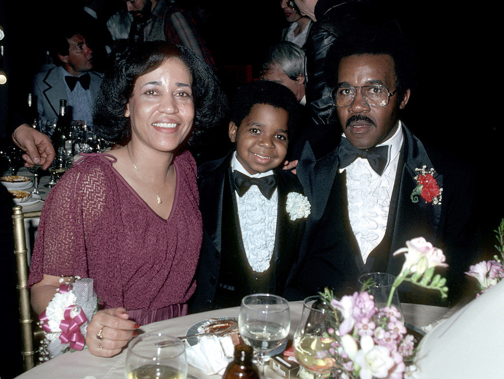 young gary with his parents at an event