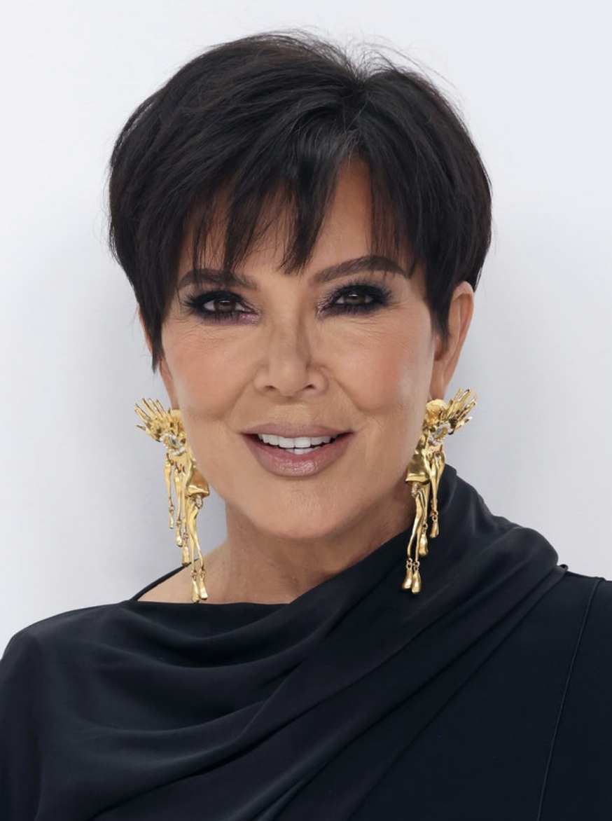 Kris Jenner in a black dress in on a red carpet in 2022
