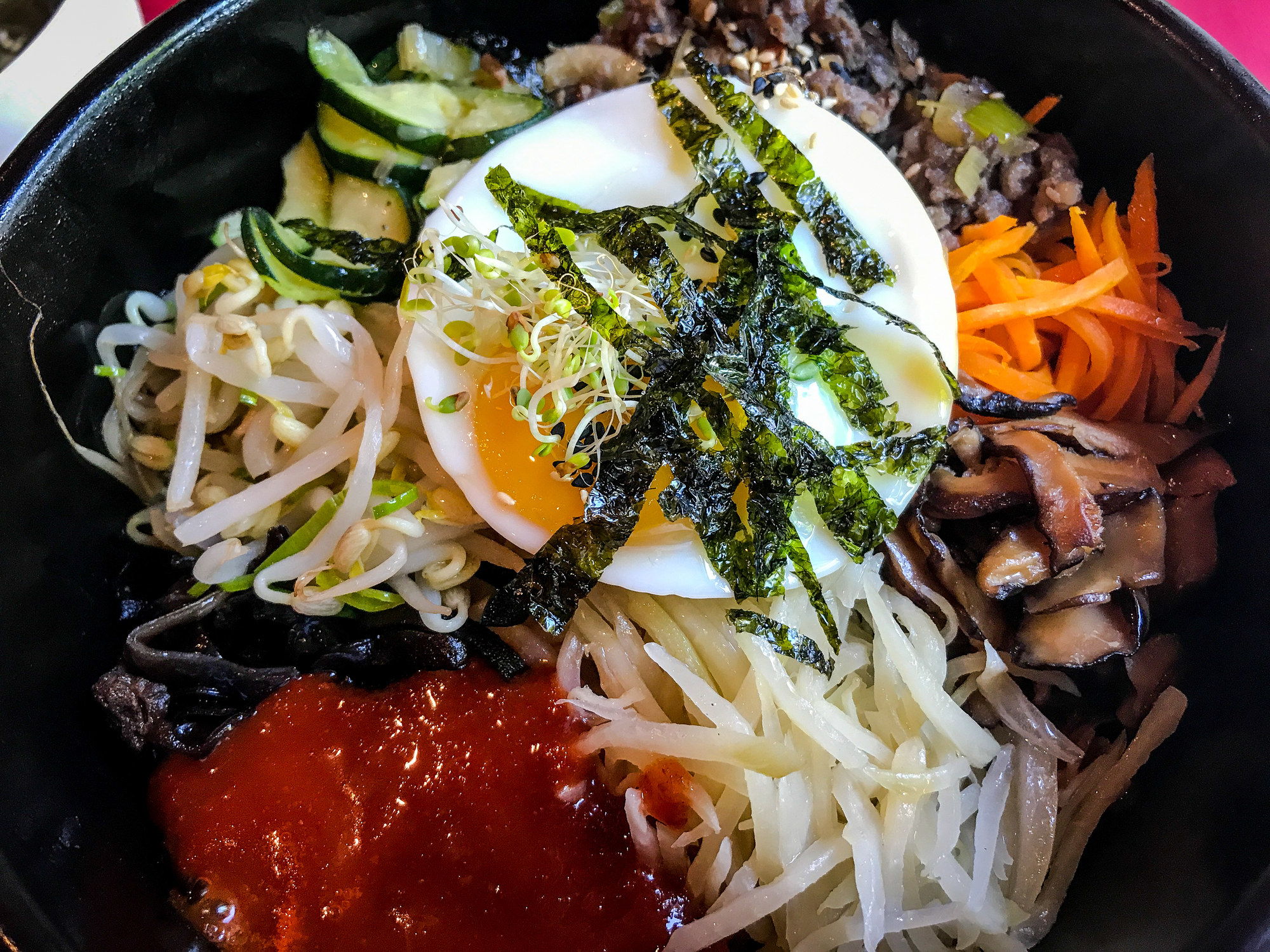 A bowl of bibimbap with gochujang.