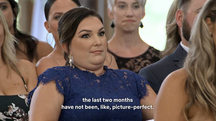 A woman with a disapproving look on her face as someone at the altar says "...the last two months have not been, like, picture-perfect"