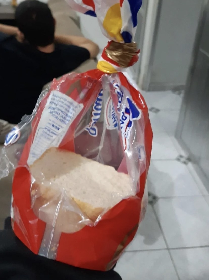 bag of bread ripped open in the middle