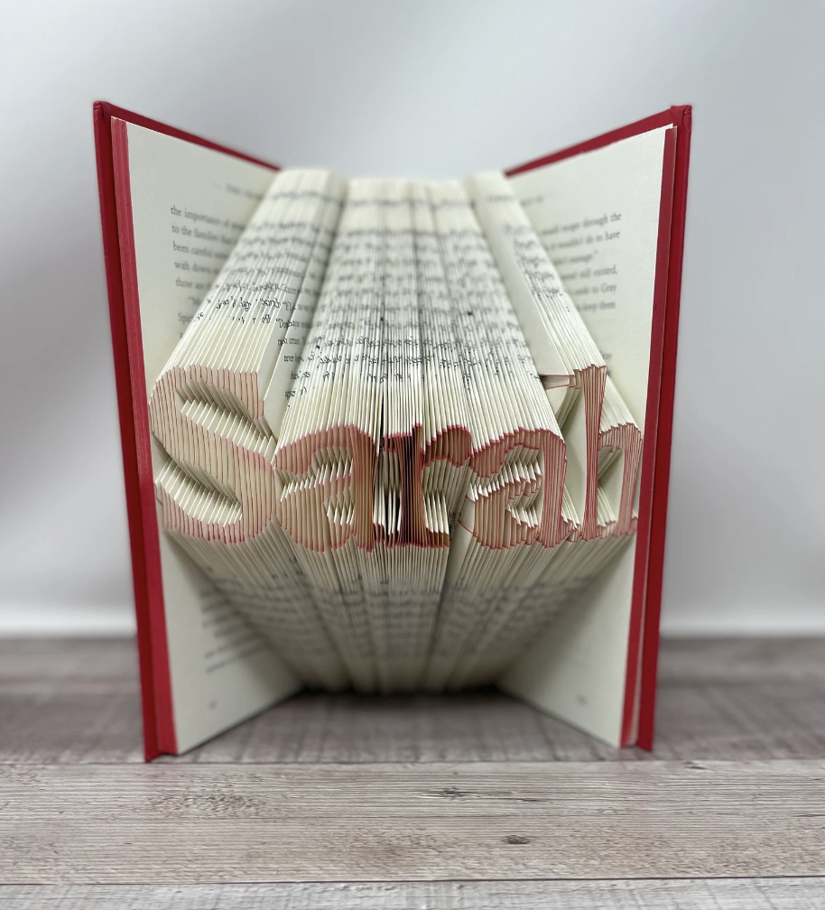 pages folded to spell out sarah