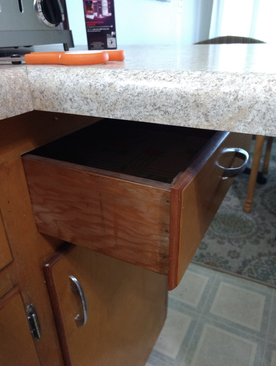 A drawer directly under a countertop