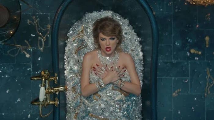 Taylor Swift lies naked in a bath filled with diamonds