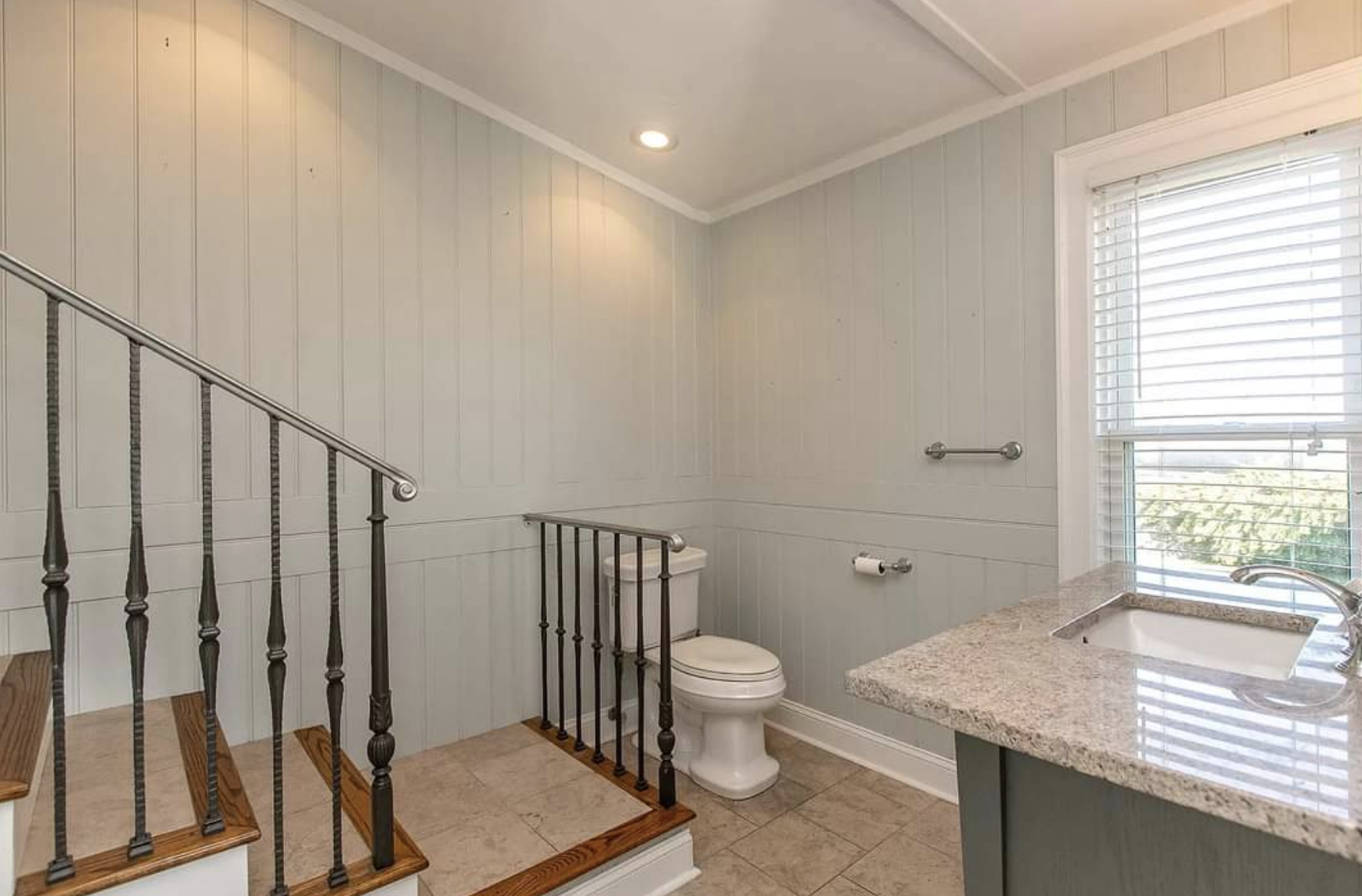 A staircase leading to a bathroom