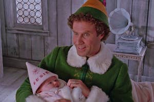 Buddy the Elf holding baby Susie