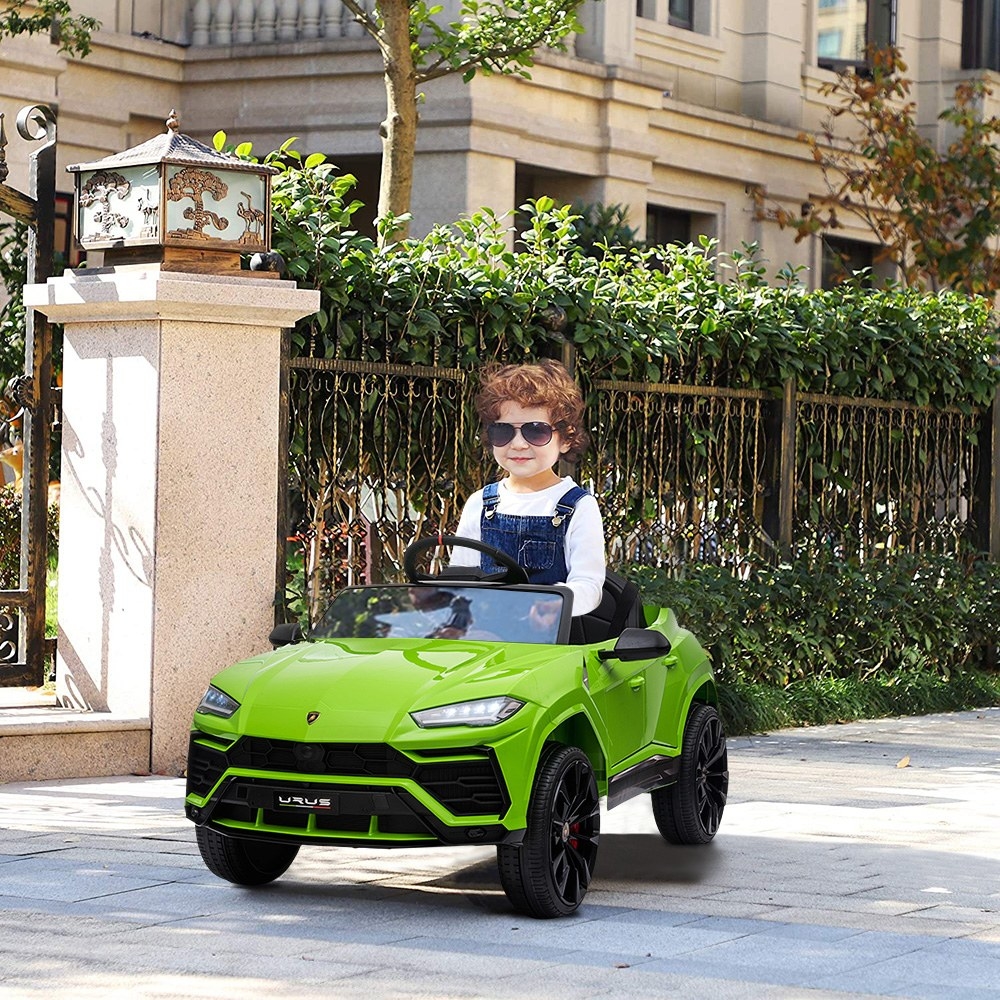 Boy in green car outside