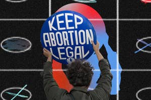 A person from behind holding a sign over their head that reads, 'Keep Abortion Legal.'