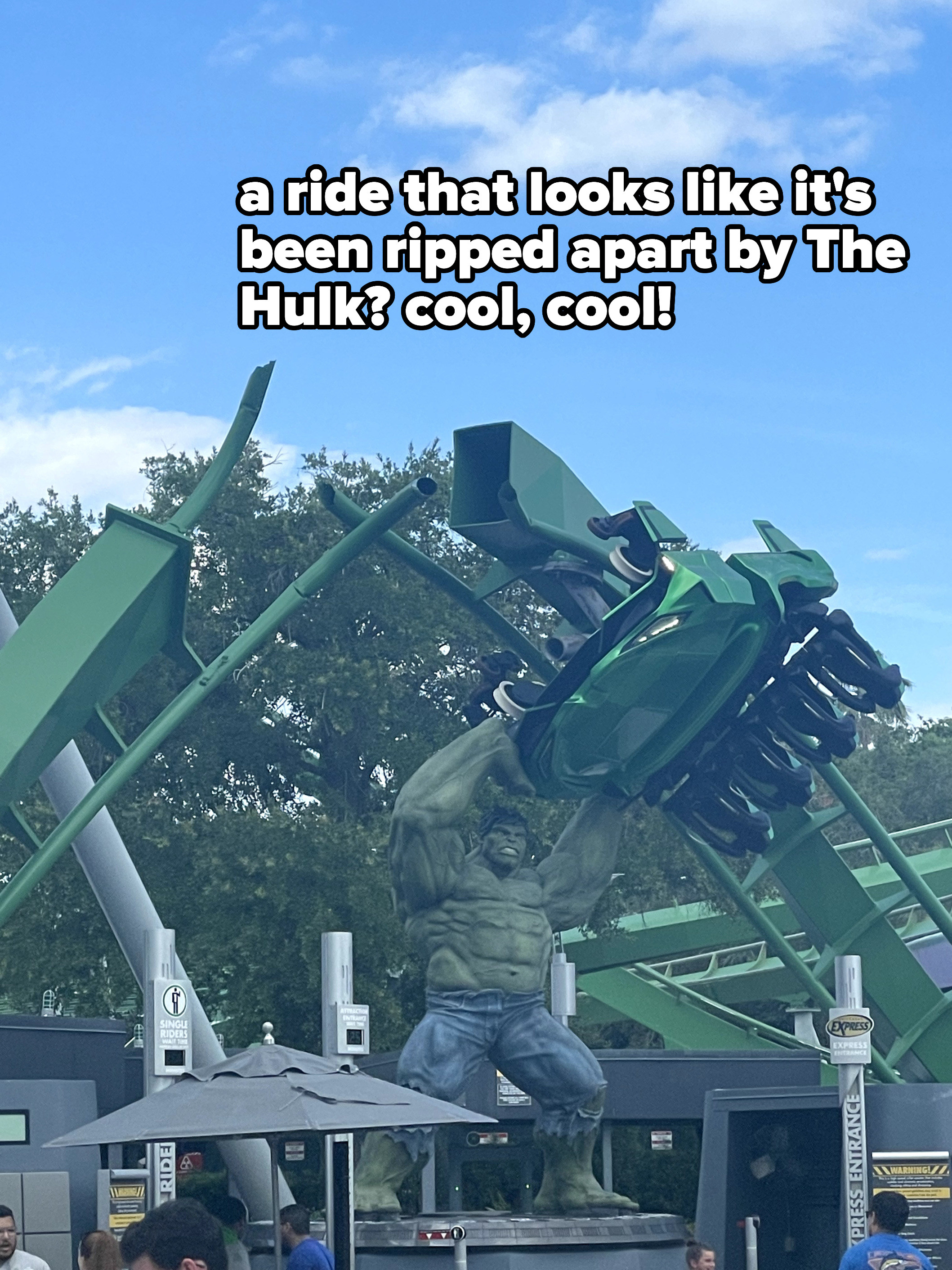 A photo of the The Hulk seemingly ripping apart the rails of a ride