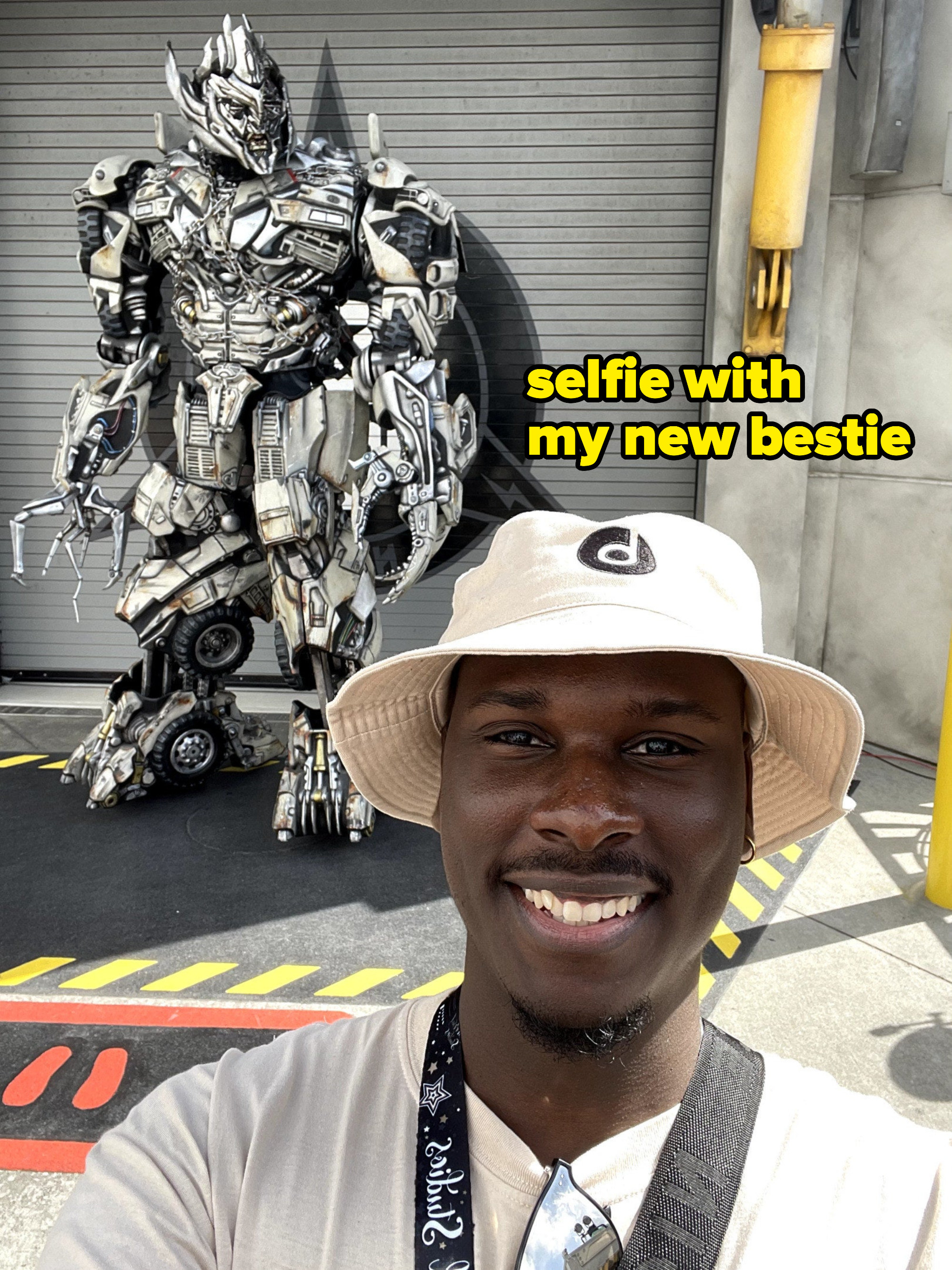 A photo of myself smiling in front of Megatron
