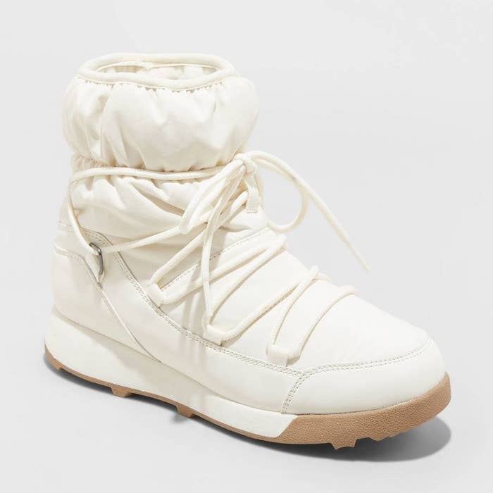 A warm white and tan winter boot