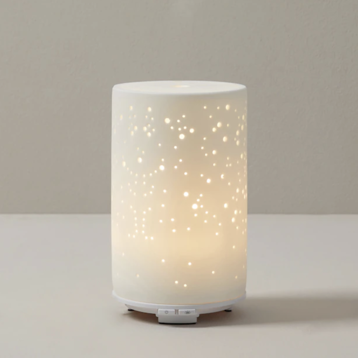 an oil diffuser with a patterned top that looks like a galaxy