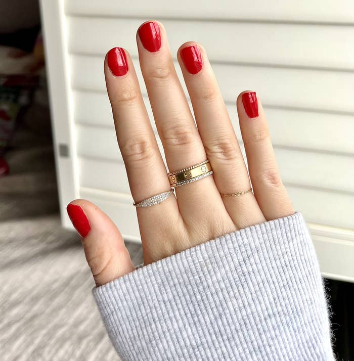 Melina wearing the ring on her index finger