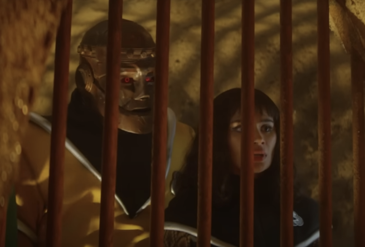 Brendan Fraser as Cliff and Diane Guerrero as Crazy Jan looking through some metal bars
