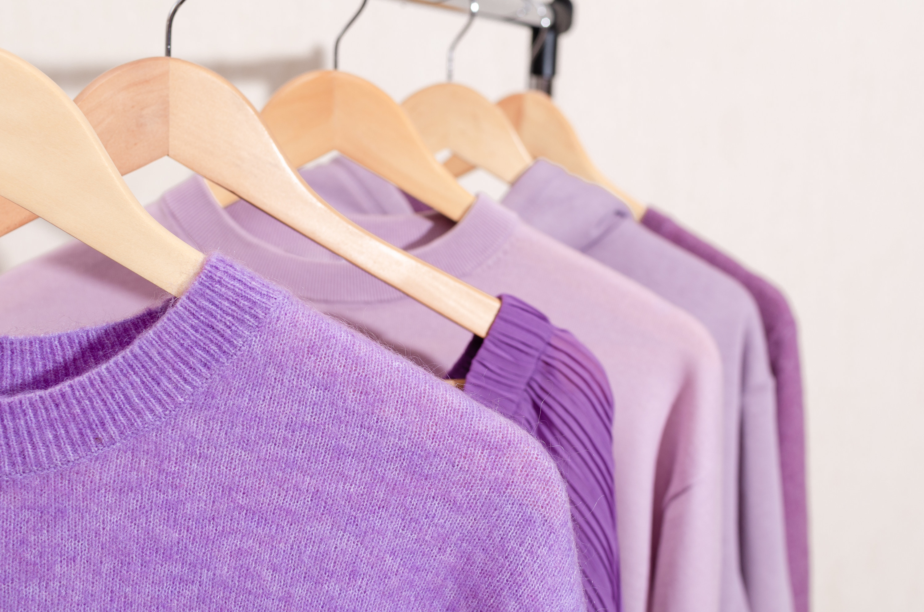 a rack of purple clothes