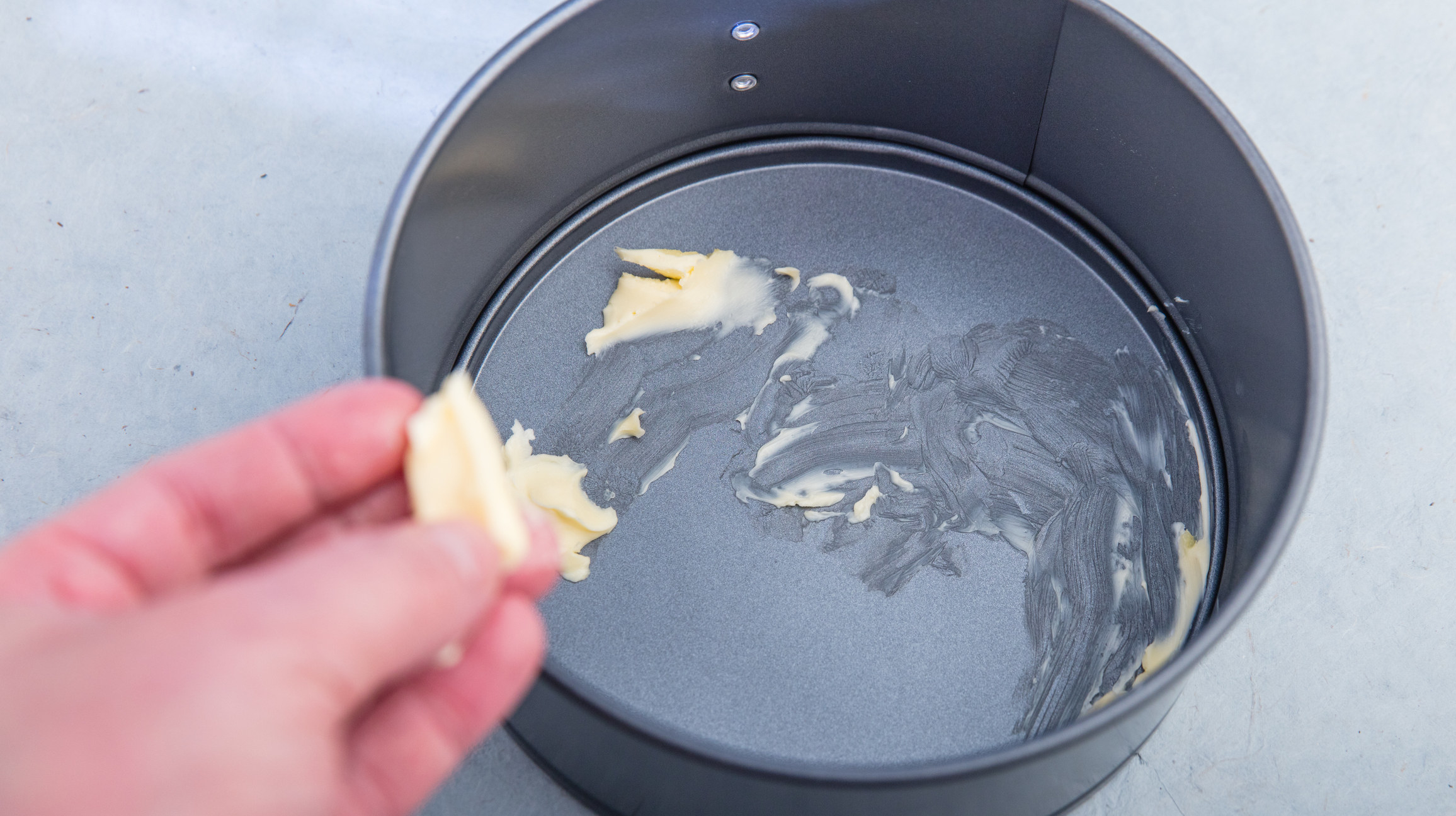 Buttering a springform pan