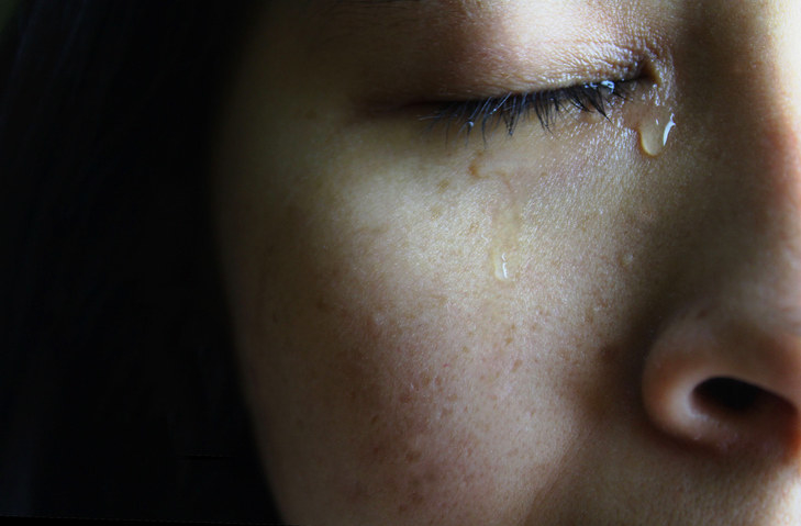 Close-up of a person with tears on their face